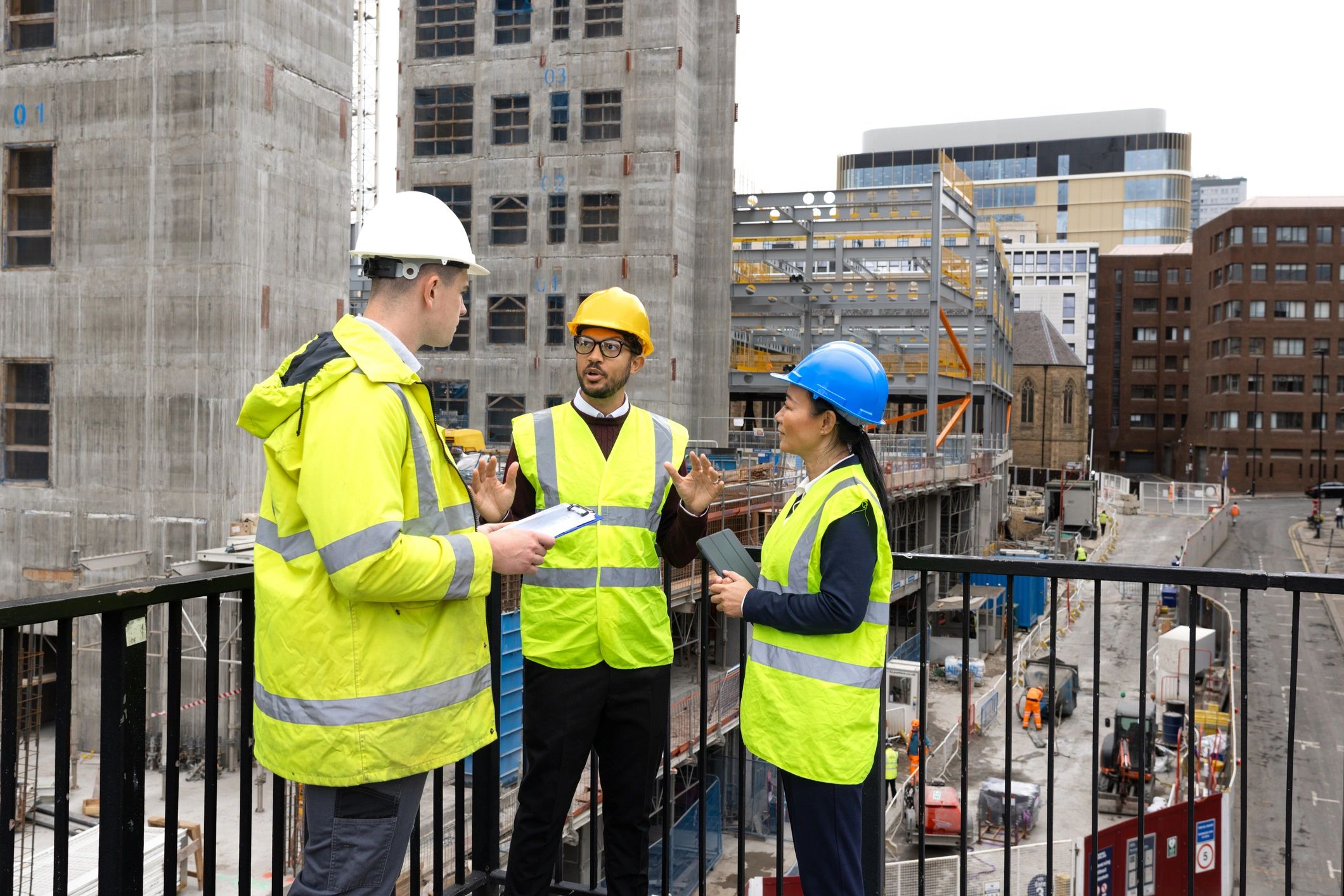 Construction management team reviewing plans on site